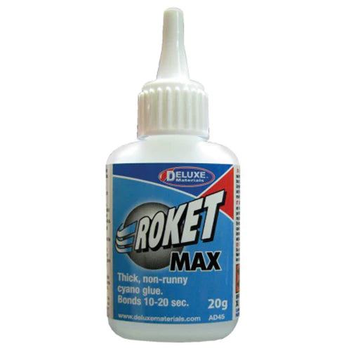 A bottle of Deluxe Materials Roket Max 20g cyano adhesive, with a white label and blue cap.