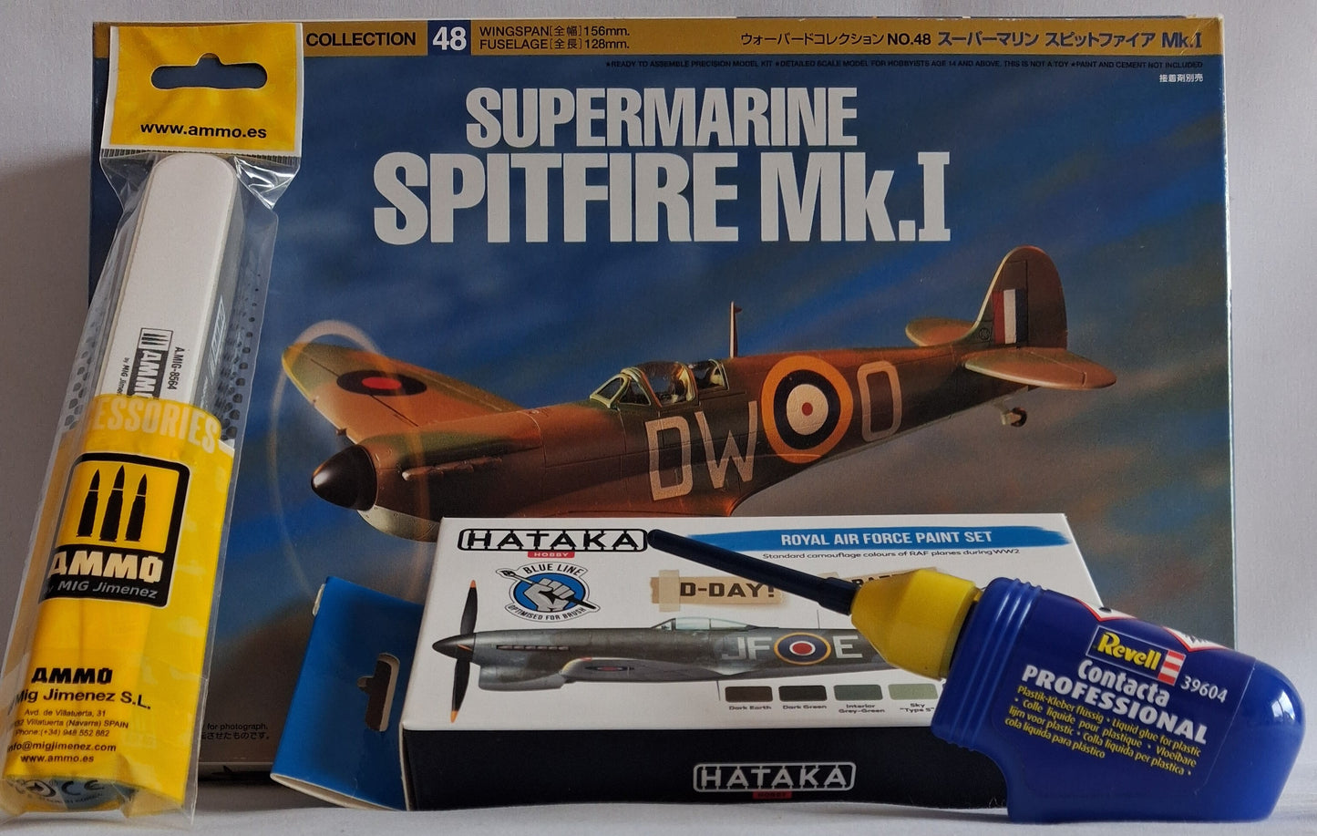 Model airplane kit packaging with Ammco and Hataka products on a gray background