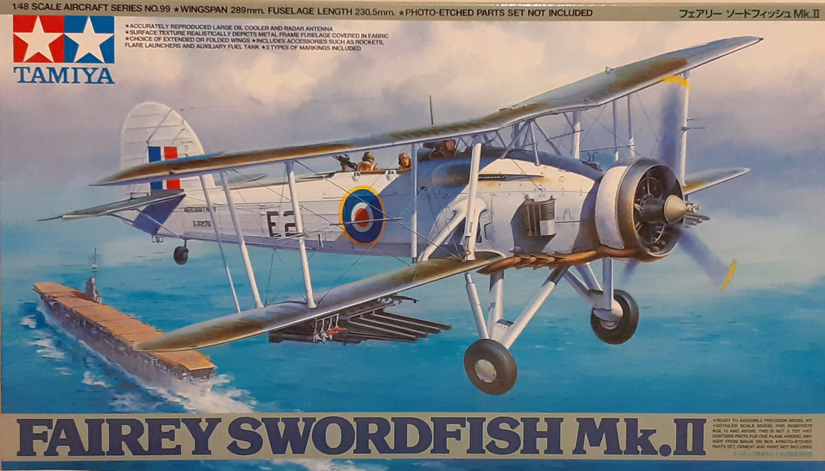 A Tamiya 1:48 scale model kit of the Fairey Swordfish MkII aircraft, featuring the plane in flight with a cloudy sky background.
