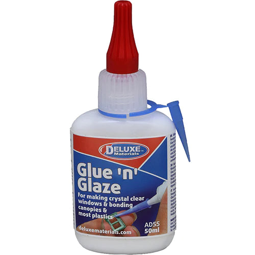A bottle of Deluxe Materials Glue 'N' Glaze with a red cap and a label that includes the brand name and product details.